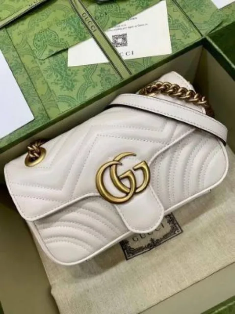 Guuci GG Marmont matelass bag features chevron quilting and antique gold toned hardware with Box premium quality