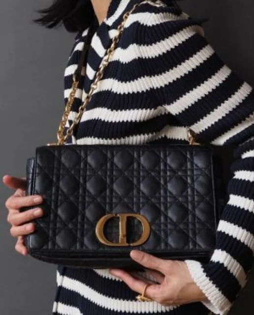 Diyor Caro bag featuring an antique gold-finish metal CD twist clasp bag with Box