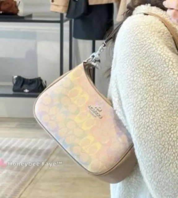 Coaach Teri shoulder bag in the Pretty Signature Canvas pattern featured in the GoldChalkPink colorway Bag with box premium quality