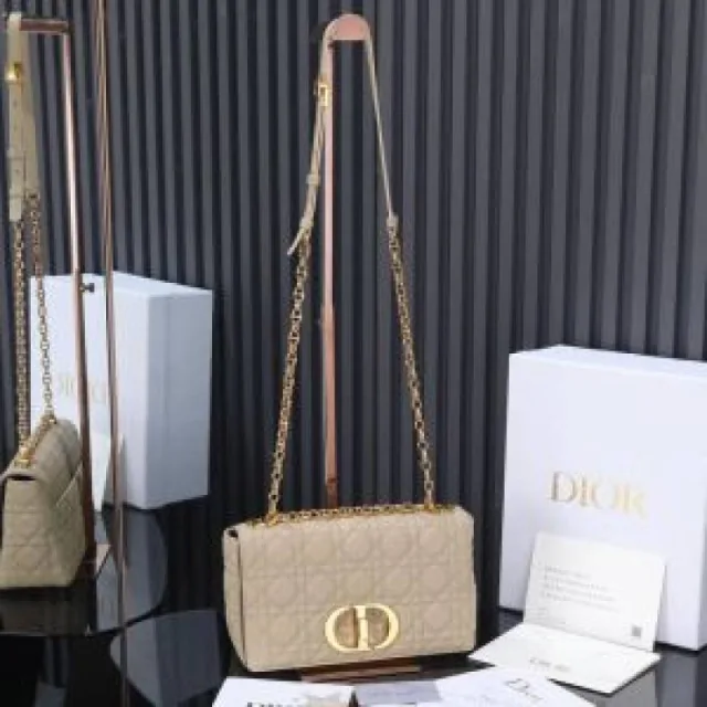 Diyor Caro bag featuring an antique gold-finish metal CD twist clasp bag with Box